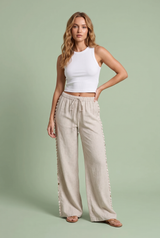 Pantalon large beige à coquillages