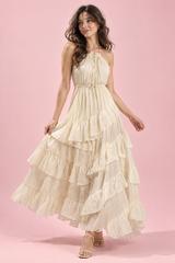 Robe longue beige à col halter, dos nu et volants
