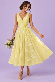 Robe midi fleurie jaune à la coupe patineuse | Vue de face | Lounelle Paris