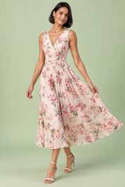Robe midi rose à imprimé de bouquets floraux, col carré et coupe trapèze | Vue en mouvement | Lounelle Paris