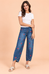 Pantalon bleu à imprimé floral et ourlet fendu