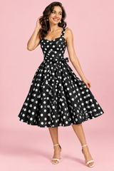 Robe courte noire à pois, coupe trapèze et encolure cœur