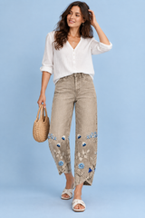 Pantalon beige à imprimé floral et ourlet fendu